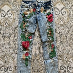 Jeans with flower designs and crystals